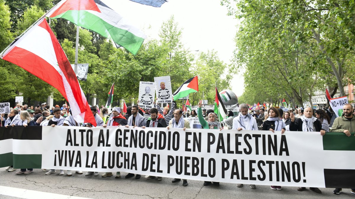 Protesters hold a banner reading 'Stop the Genocide in Palestine. Long live the struggle of the Palestinian people' during a pro-Palestinian rally to protest against the arms trade with Israel, in Madrid, Spain, May 10, 2025. (EPA Photo)