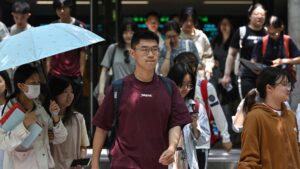 Chinese students walk at Beijing Foreign Studies University in Beijing, CHina, May 29, 2025. (AFP Photo)