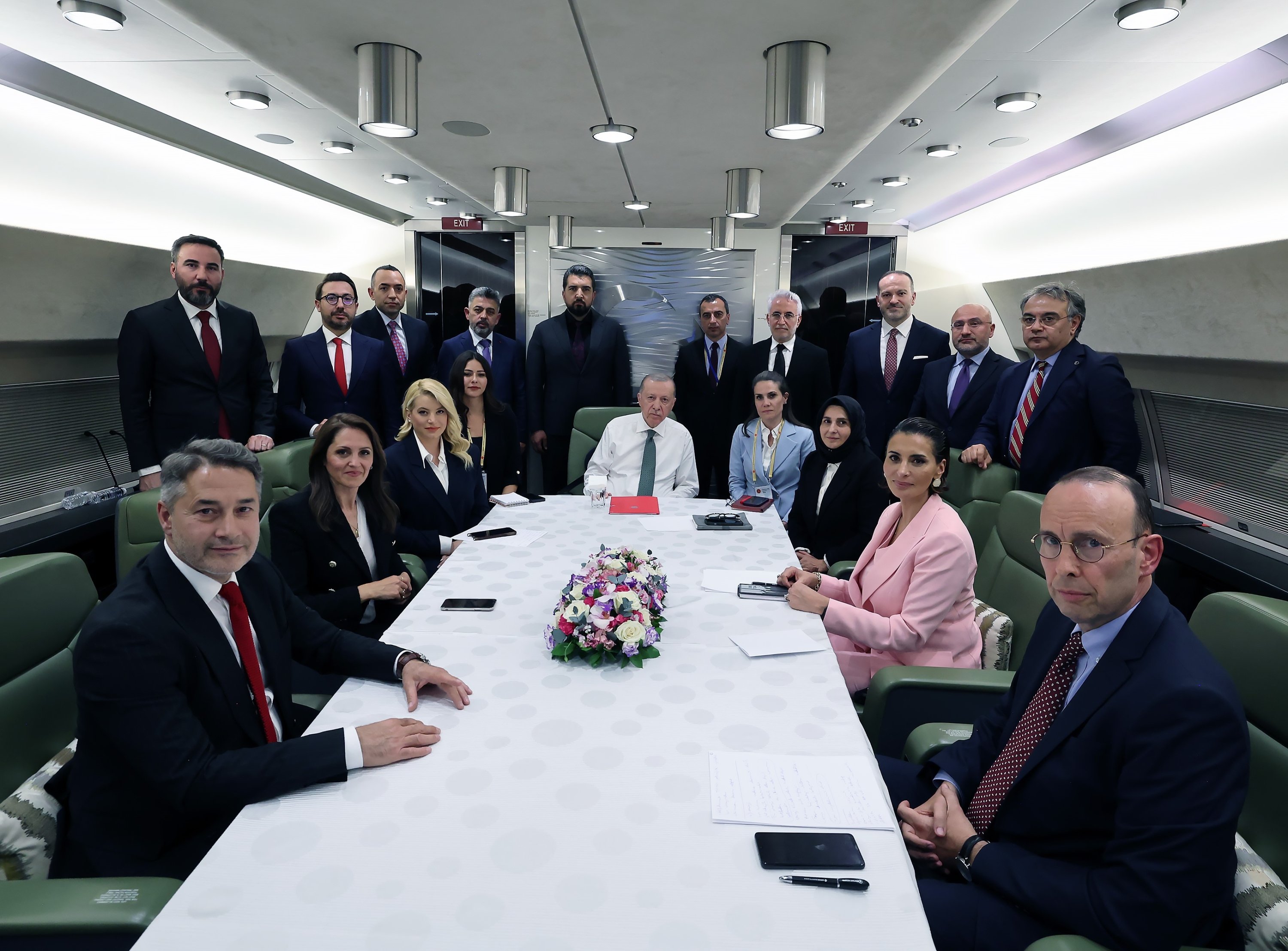 384586 President Recep Tayyip Erdoğan (C) holds an interview with Turkish journalists on the presidential plane during a flight back from Azerbaijan. (IHA Photo)