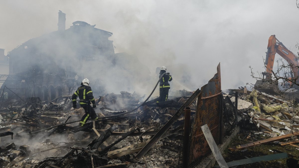 Ukrainian rescuers work at the site of a residential area struck by a rocket as a result of an overnight strike amid the ongoing Russian invasion, in a village near Kyiv, Ukraine, May 25, 2025. (EPA Photo)