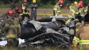 South Korean firefighters and military officers work at the scene of a South Korean navy plane crash in Pohang, South Korea, May 29, 2025. (AP Photo)