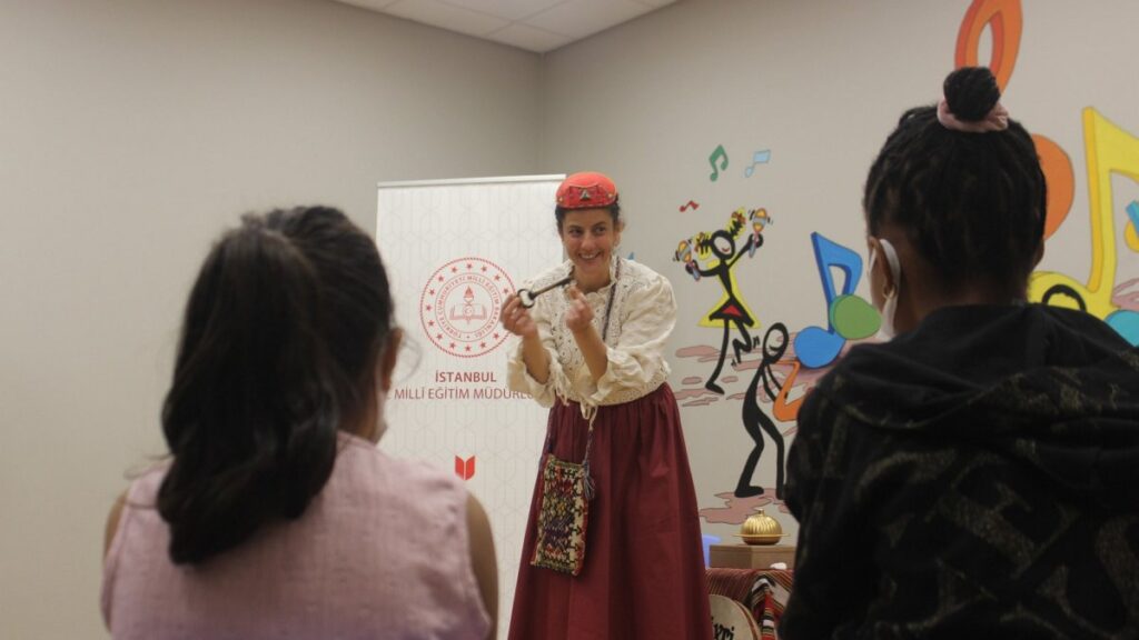 A teacher from the Istanbul Fairy Tale School explains a story to young patients during a Masalhane session, Istanbul, Türkiye, May 22, 2025. (AA Photo)