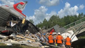 Emergency workers at the scene, after a road bridge collapsed onto railway tracks due to an explosion in the Bryansk region, Russia, June 1, 2025. (Reuters Photo)