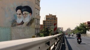 Iranians drive past a wall painting of Iranian supreme leader Ayatollah Ali Khamenei (R) and late Iranian supreme leader Ayatollah Ruhollah Khomeini (L) on a street in Tehran, Iran, June 1, 2025. (EPA Photo)