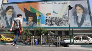 Iranians walk past portraits of Ayatollah Ali Khamenei (L) and late Iranian supreme leader Ayatollah Ruhollah Khomeini in Tehran, Iran, June 1, 2025. (EPA Photo)