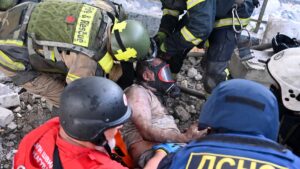 Rescuers carry a wounded person out of the ruins of a civilian plant following Russian powerful attacks on eastern city of Kharkiv, Ukraine, June 7, 2025. (AFP Photo)