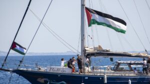 Activist Greta Thunberg and crew stand aboard the aid ship Madleen, which will travel to Gaza to deliver humanitarian aid before setting sail from the port of Catania, Italy, June 1, 2025. (AA Photo)