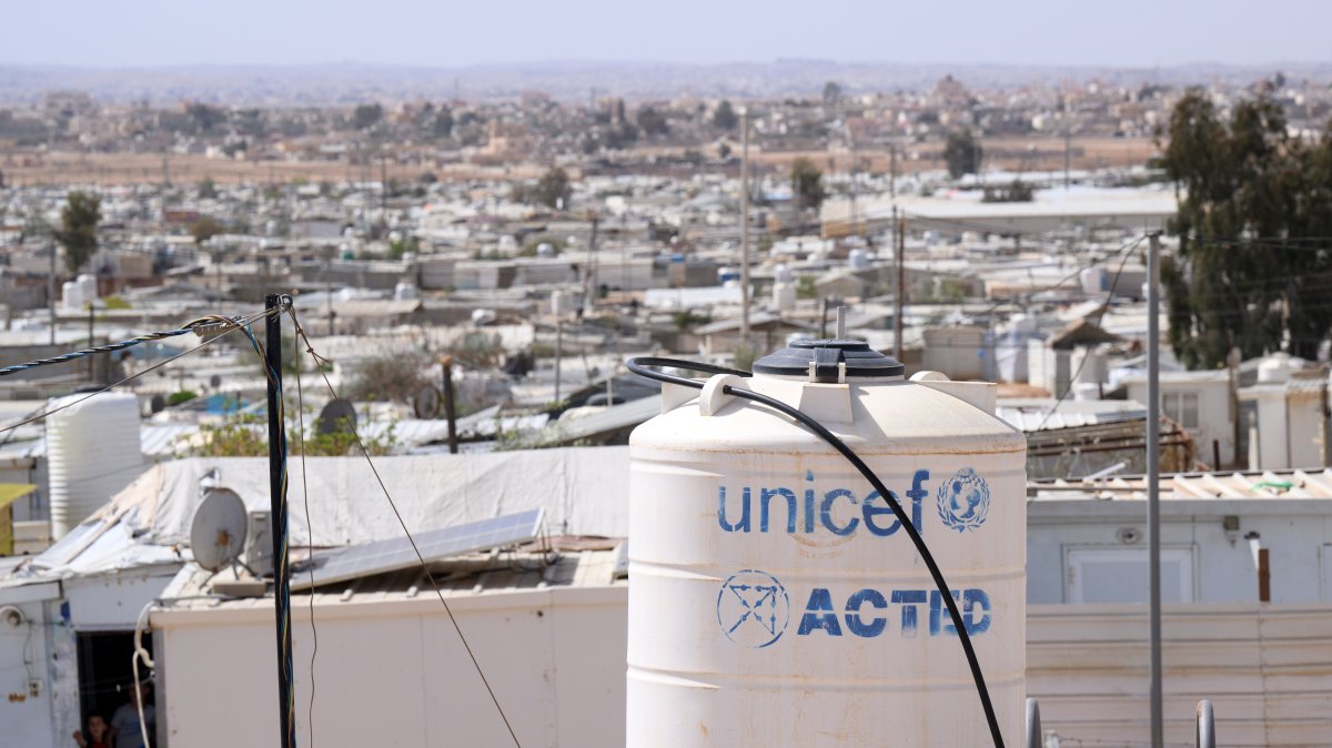 Corrugated iron huts and a water tank labeled UNICEF stand in the Jordanian refugee camp Saatari, bordering Syria, Saatari, Jordan,27 March 2025. (Getty Images Photo)