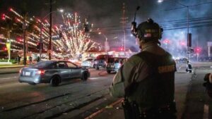 A firework sent by protesters explodes near the Los Angeles Sheriff Department officers during immigration protests, Paramount, California, U.S., June 7, 2025. (AFP Photo)