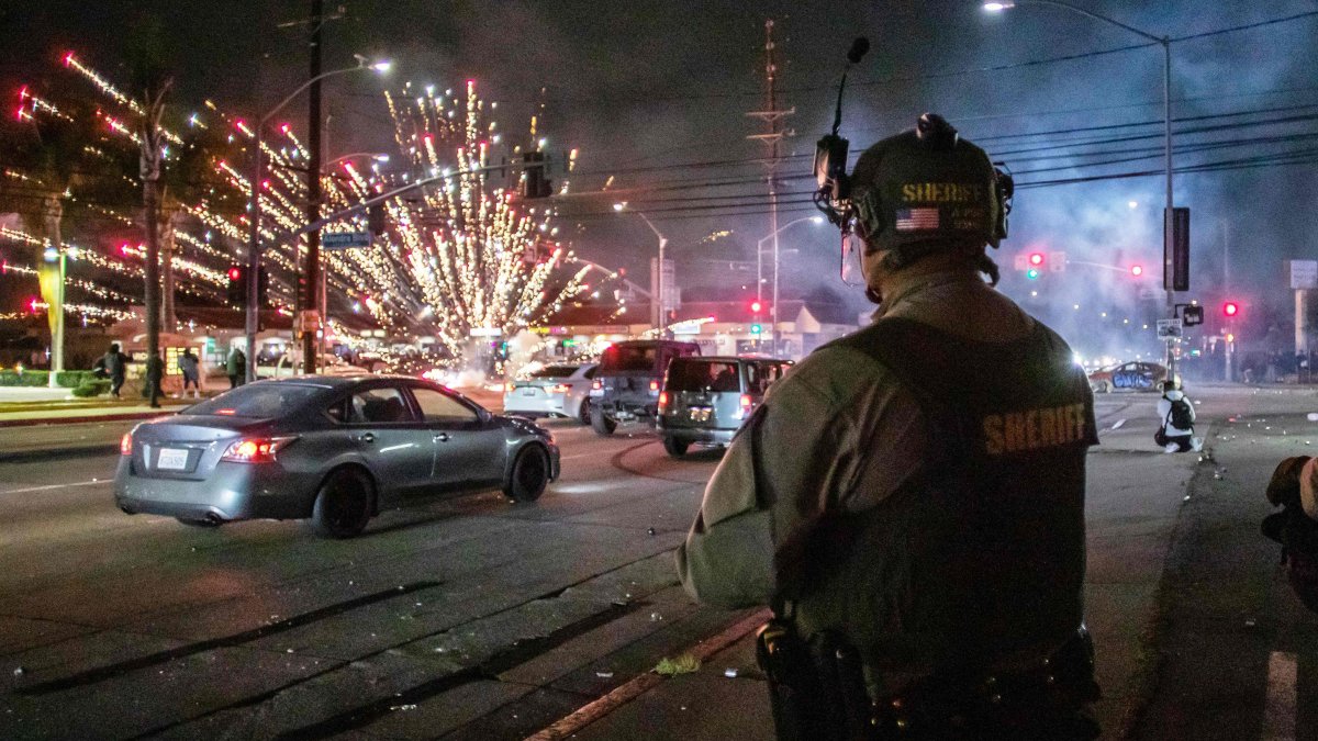A firework sent by protesters explodes near the Los Angeles Sheriff Department officers during immigration protests, Paramount, California, U.S., June 7, 2025. (AFP Photo)