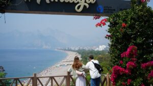 Tourists are photographed while enjoying a view of a beach in Antalya, southern Türkiye, June 6, 2025. (IHA Photo)