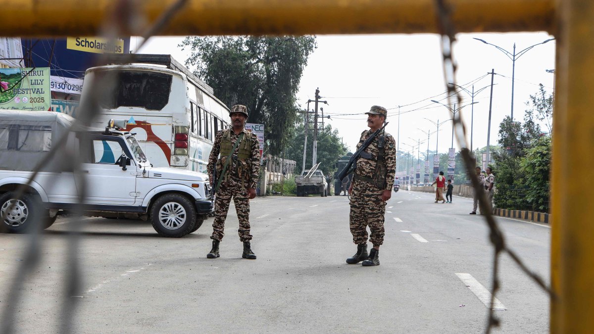 Security personnel stand guard at a checkpoint after a curfew was imposed following recent violence in Imphal, Manipur state, India, June 8, 2025. (AFP Photo)