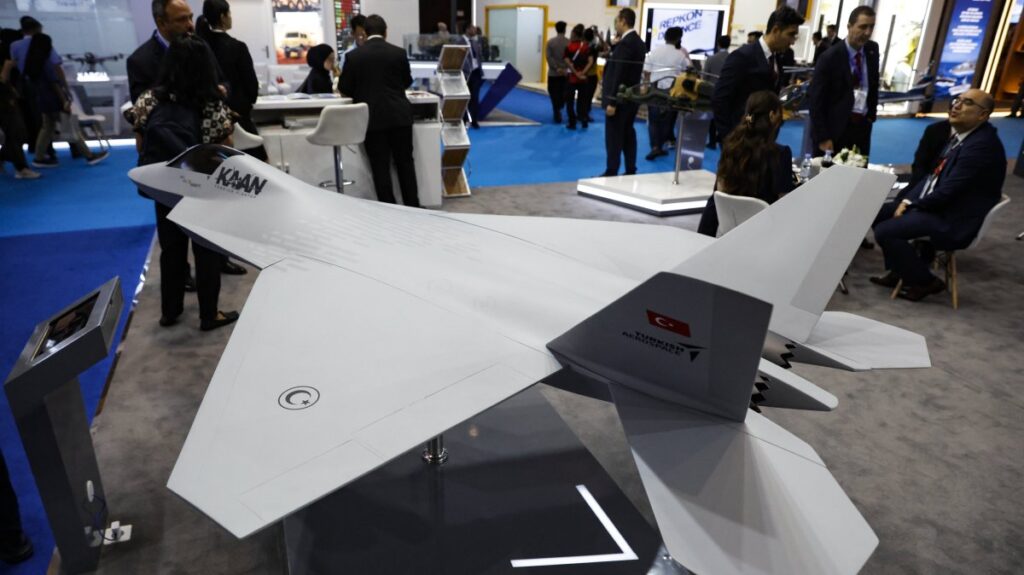 Visitors stand near miniatures of Turkish combat aircraft Kaan during the Indo Defense 2025 exhibition, Jakarta, Indonesia, June 12, 2025. (EPA Photo)