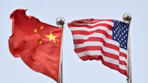 Chinese and U.S. flags wave outside a technology company, Beijing, China, April 17, 2025. (AFP Photo)