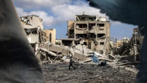 A young boy walks through the debris at the site of an Iranian missile strike in Bnei Brak, east of Tel Aviv, June 16, 2025. (AFP Photo)