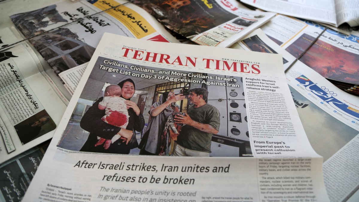 The front page of an Iranian newspaper is seen at a newsstand in Tehran, Iran, on June 16, 2025. (AA Photo)