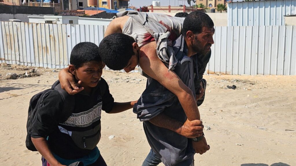 Palestinians carry a wounded man, injured as he was queuing for aid in Rafah, southern Gaza Strip, Palestine, June 16, 2025. (AFP Photo)