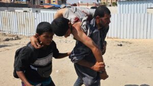 Palestinians carry a wounded man, injured as he was queuing for aid in Rafah, southern Gaza Strip, Palestine, June 16, 2025. (AFP Photo)