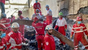 Iranian Red Crescent members search the debris of a building struck by Israel, Tehran, Iran, June 17, 2025. (AFP Photo)