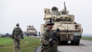 A soldier from the U.S.-led coalition stands guard during a patrol in the countryside of Qamishli, northeastern Syria, Feb. 8, 2024. (Reuters Photo)