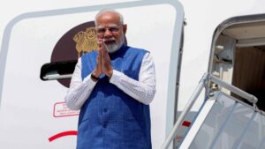 Indian Prime Minister Narendra Modi gestures as he steps off the plane upon his arrival in Zagreb, Croatia, June 18, 2025. (AFP Photo)