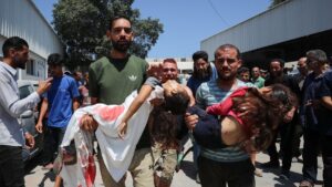 Relatives carry the bodies of two girls, as they leave Al-Shifa Hospital, after Palestinians were killed by an Israeli strike on a tent encampment sheltering displaced people, in Gaza City, June 19, 2025. (Reuters Photo)