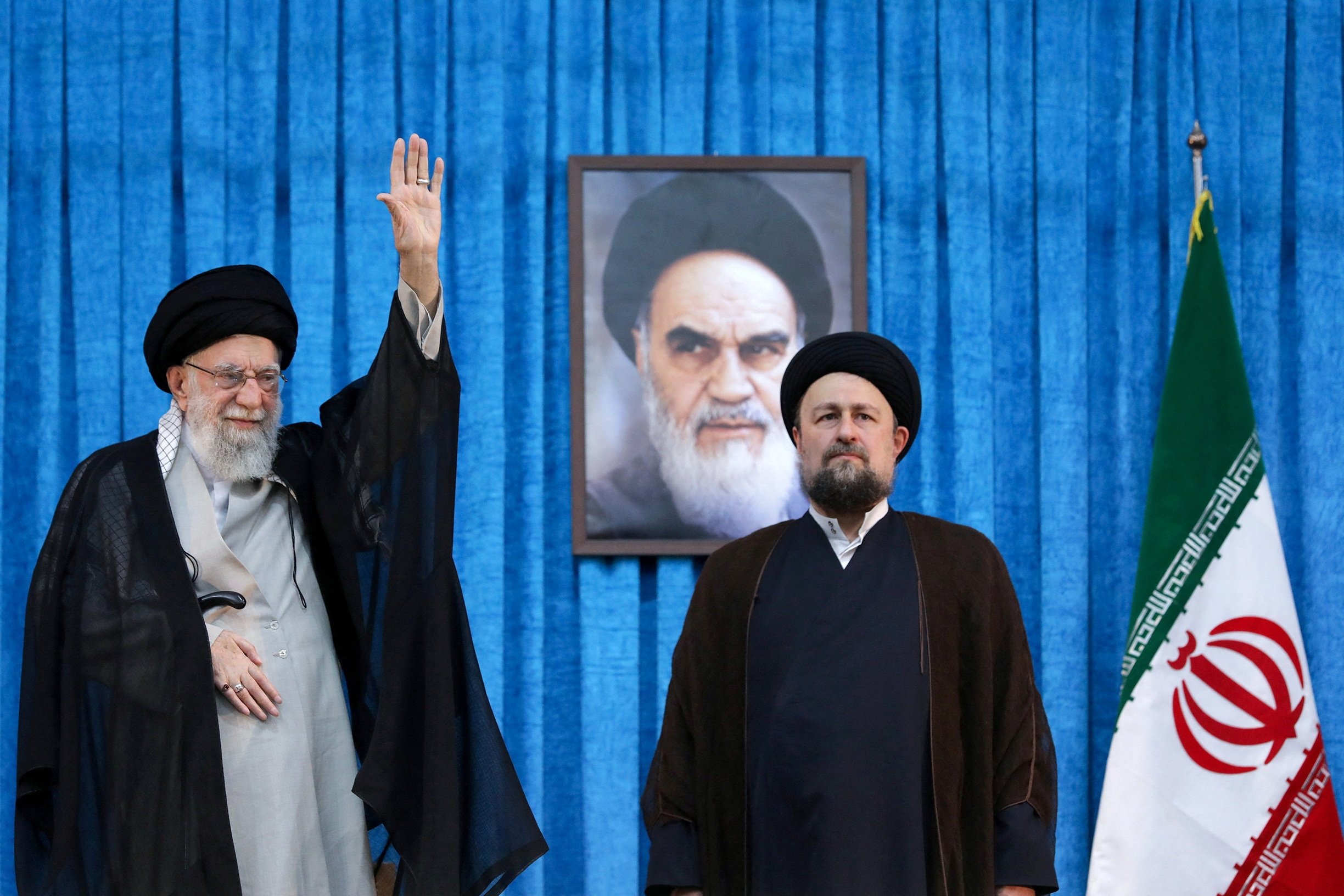 387970 1979 Islamic Revolution leader Ayatollah Ruhollah Khomeini's grandson, Hassan Khomeini (R), stands next to Iranian Supreme Leader Ayatollah Ali Khamenei during the ceremony marking the 36th anniversary of Ayatollah Ruhollah Khomeini's death, Tehran, Iran, June 4, 2025. (Reuters Photo)