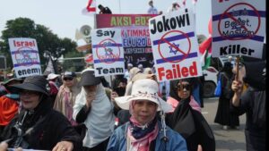 Hundreds of Muslims march in the streets of Indonesia's capital to protest against the Israeli team's participation in the FIFA World Cup Under-20 in Indonesia.