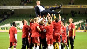 Denmark players celebrate with coach Age Hareide after beating Republic of Ireland in 2018 World Cup Qualifications at Aviva Stadium, Dublin, Republic of Ireland on November 14, 2017.
