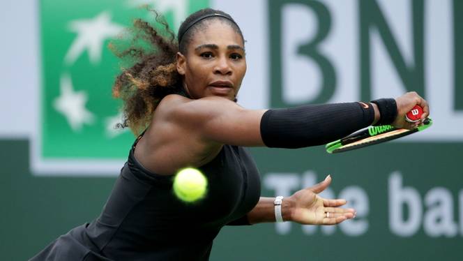 Serena Williams lunges to return a backhand to Kiki Bertens of the Netherlands during the BNP Paribas Open at the Indian Wells Tennis Garden in Indian Wells, California on March 10, 2018.