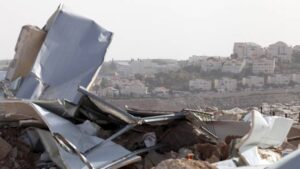 A view shows the remains of a Palestinian dwelling, that was funded by the EU's humanitarian arm, after it was demolished by Israeli forces, as the Israeli West Bank settlement of Maale Adumim is seen in the background, near the West Bank village of Al-Eizariya, near east of Jerusalem January 21, 2016..
