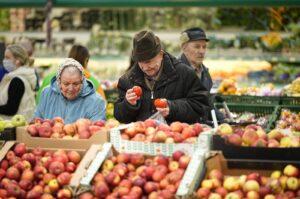 People buy fruit at a supermarket, Moscow, Russia, Nov. 3, 2023. (AP Photo)