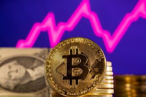 A representation of the cryptocurrency bitcoin is seen in front of a stock graph and U.S. dollar in this illustration taken, Jan. 24, 2022. (Reuters Photo)